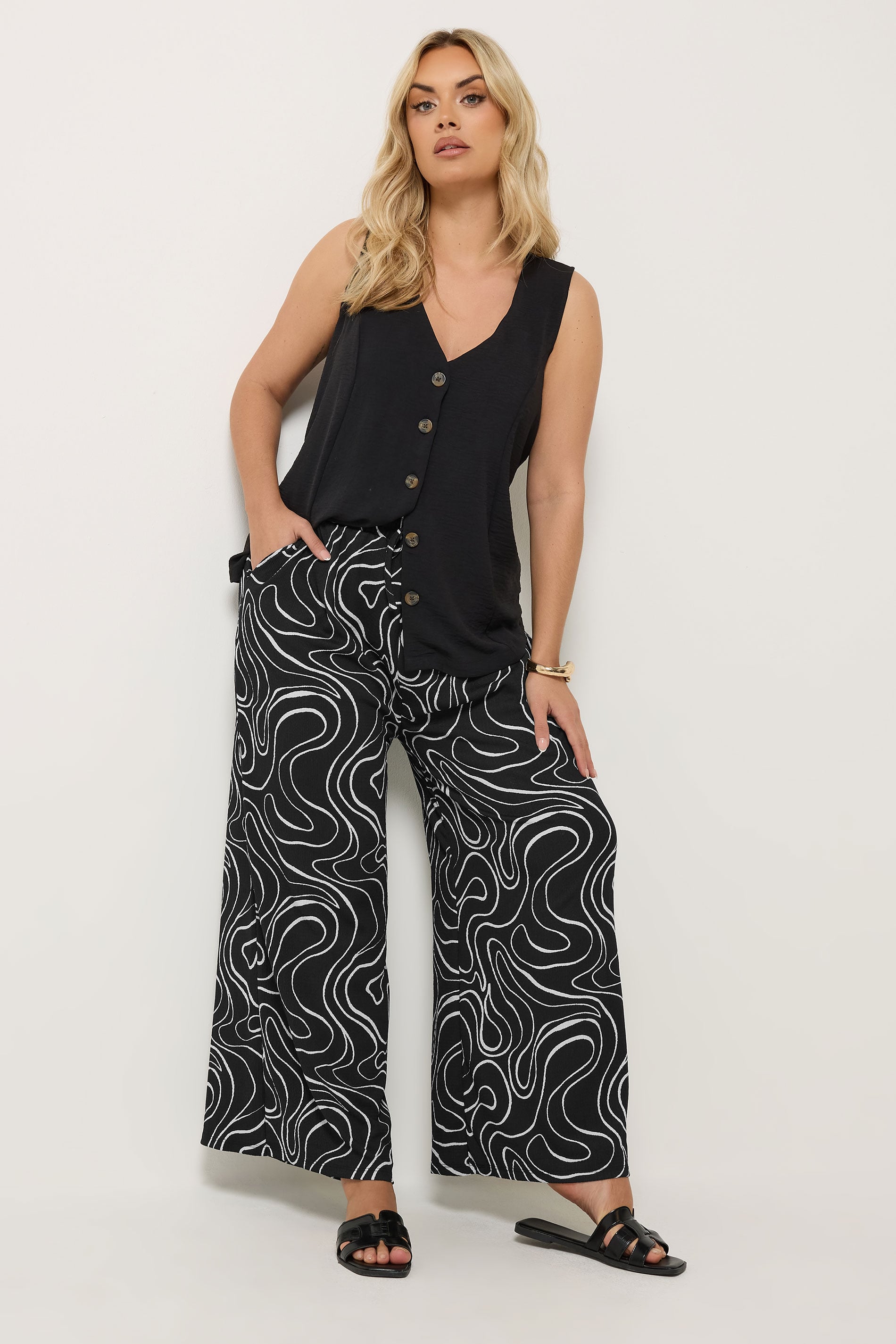 YOURS Plus Size Black Swirl Wide Leg Trousers | Yours Clothing 1