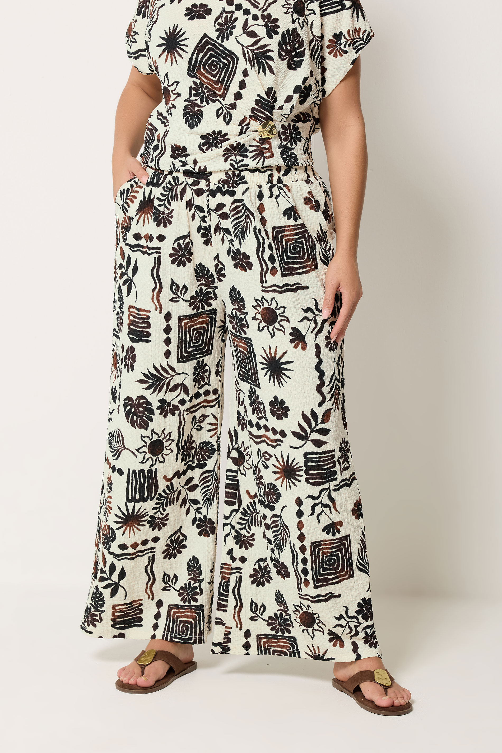 YOURS Plus Size Natural Brown Summer Print Crinkle Wide Leg Trousers | Yours Clothing 1