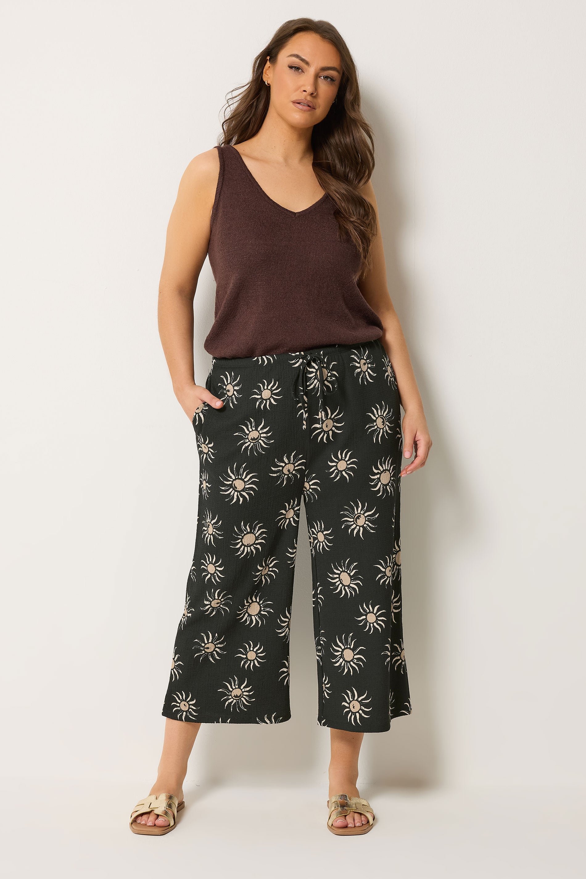 YOURS Plus Size Black Sun Print Cropped Wide Leg Trousers | Yours Clothing 1