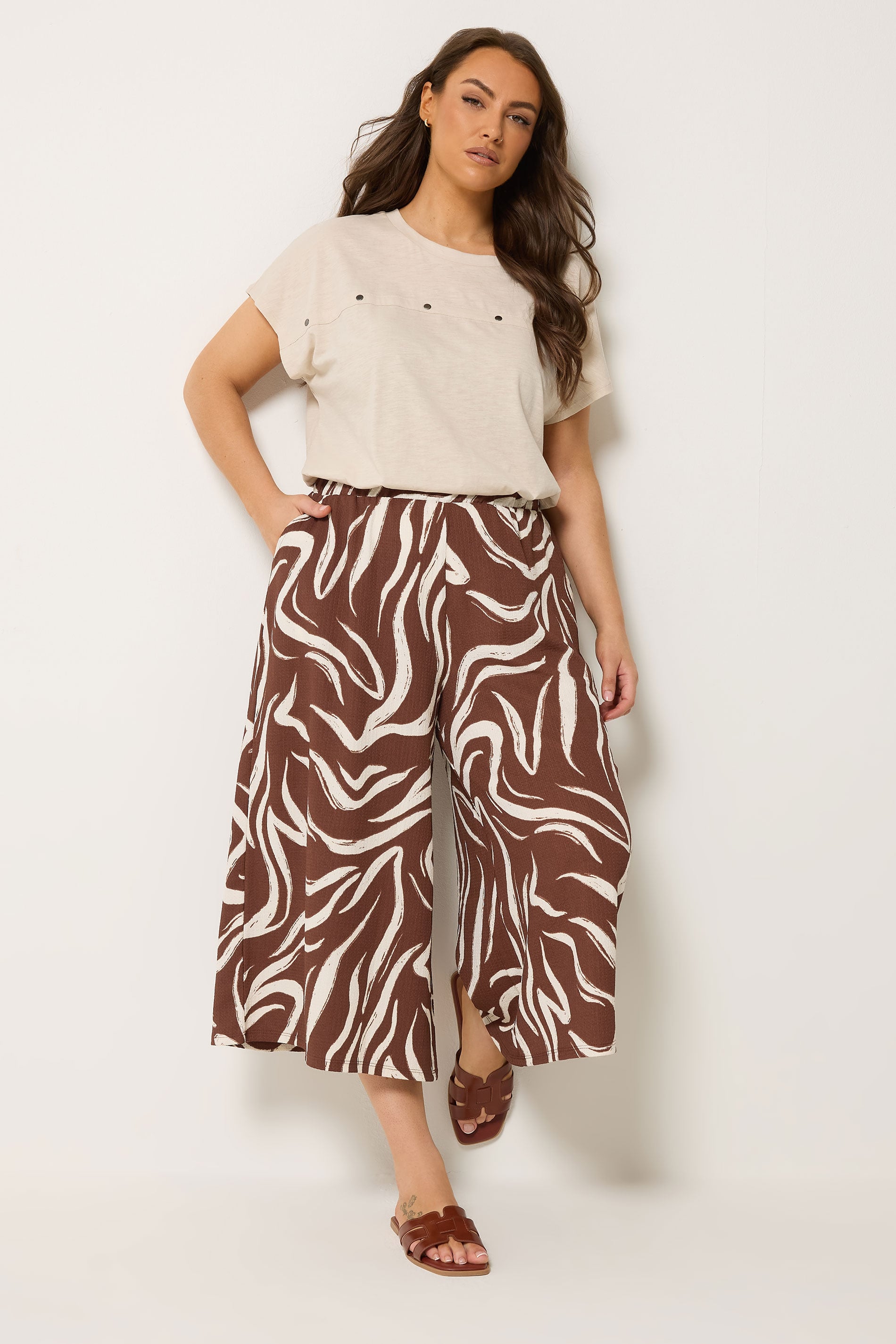 YOURS Plus Size Brown Abstract Cropped Wide Leg Trousers | Yours Clothing 1