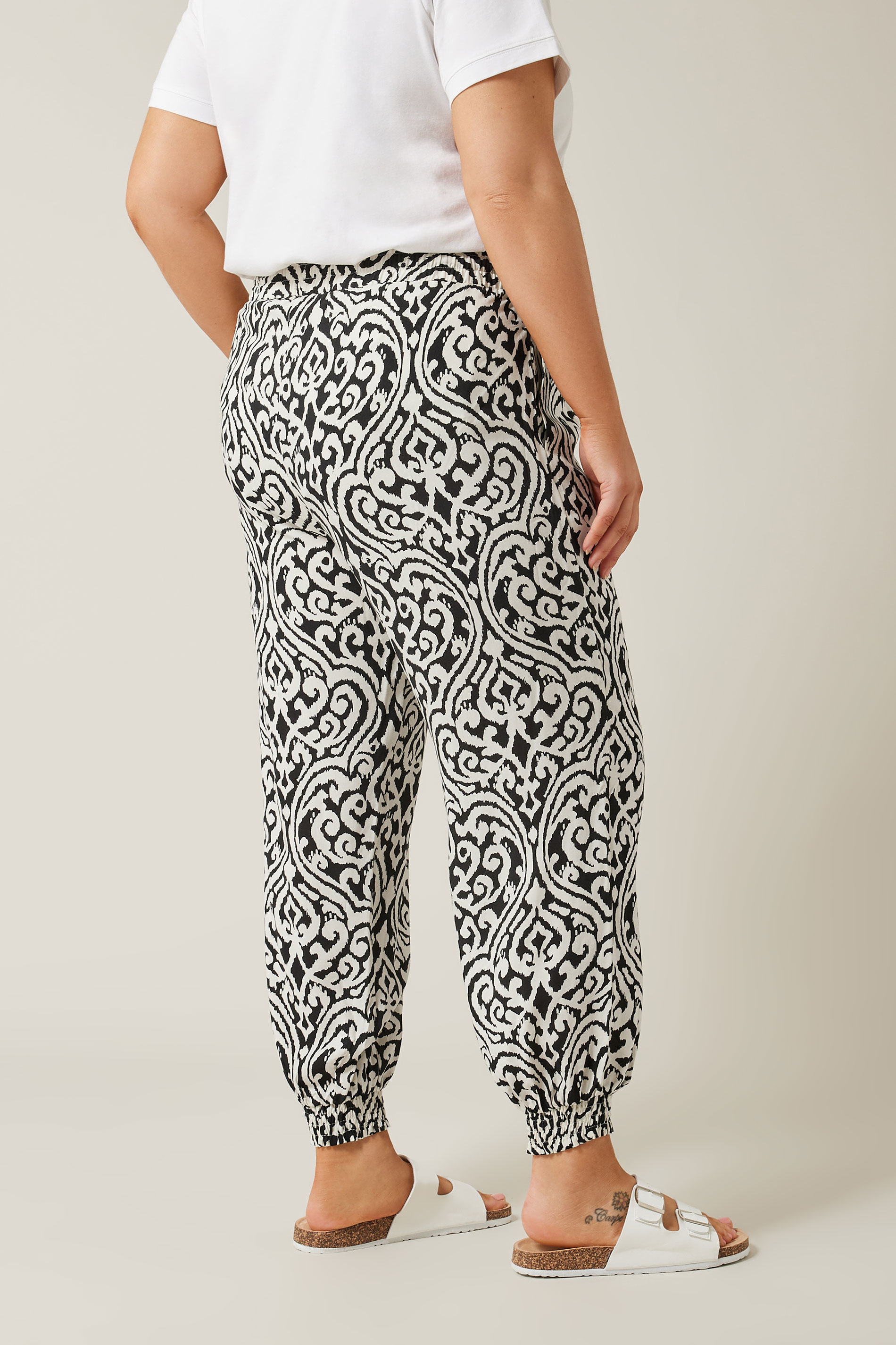 EVANS Plus Size Black Ikat Print Cuffed Harem Trousers | Evans  2