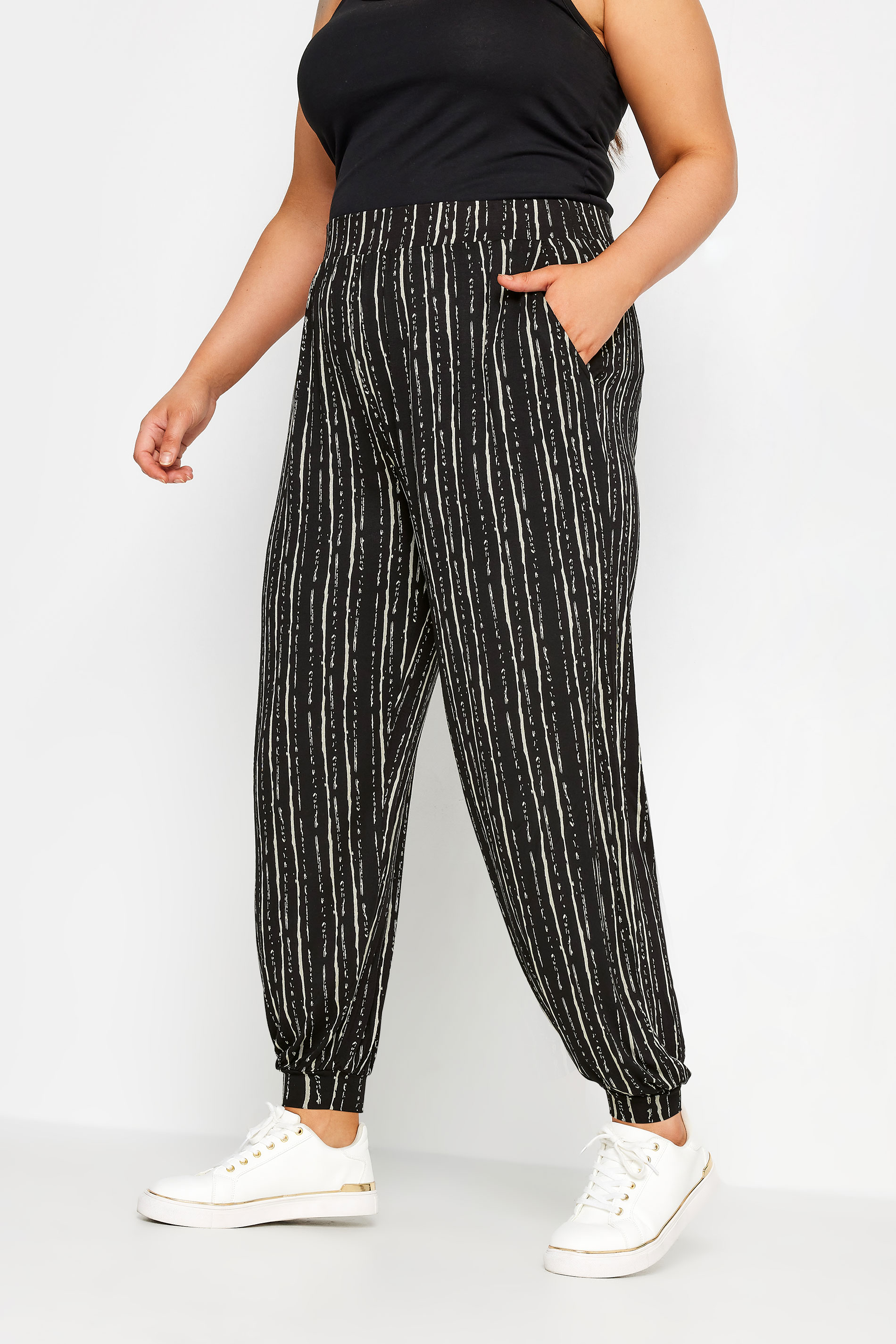 YOURS Plus Size Black Striped Harem Joggers | Yours Clothing 1