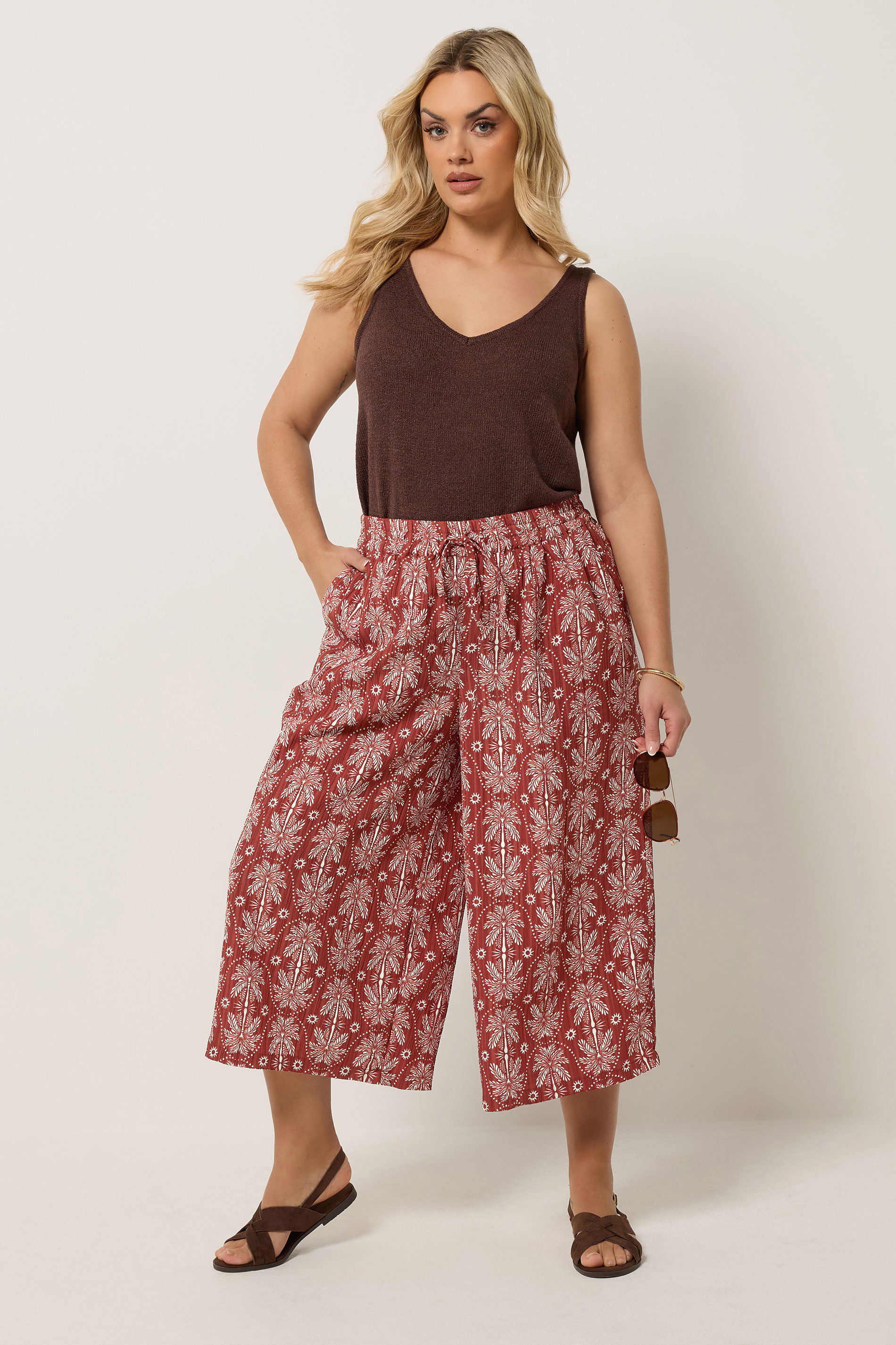 YOURS Plus Size Rust Orange Palm Tree Cropped Trousers | Yours Clothing 1