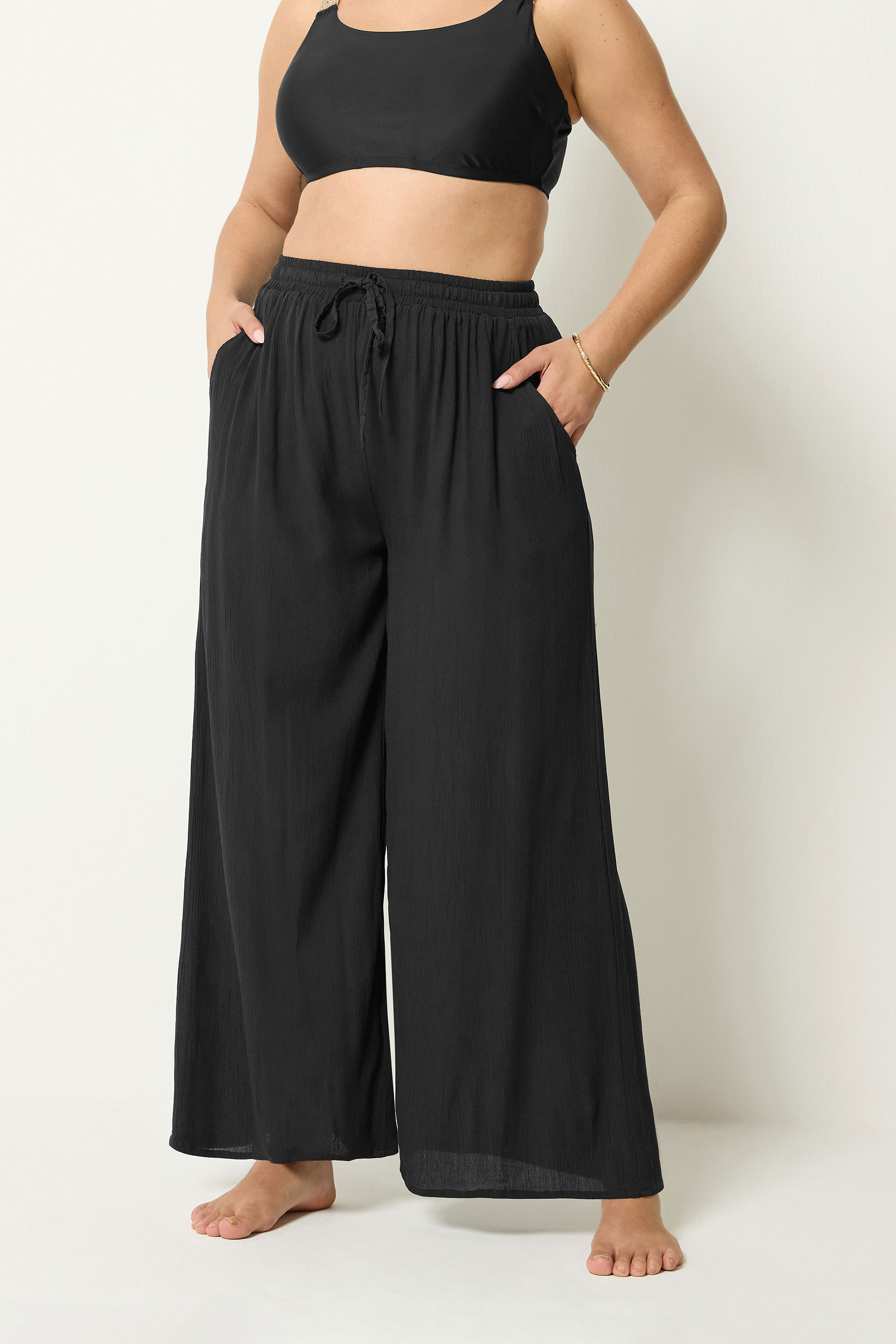 YOURS Plus Size Black Crinkle Texture Wide Leg Trousers | Yours Clothing 1