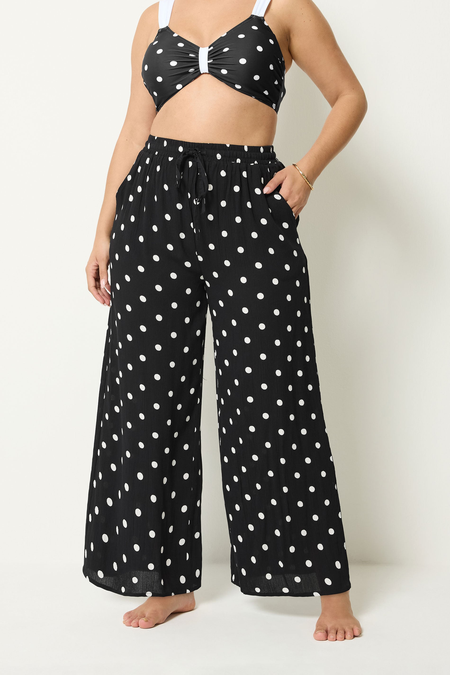 YOURS Plus Size Black Polka Dot Crinkle Beachwear Wide Leg Trousers | Yours Clothing 1