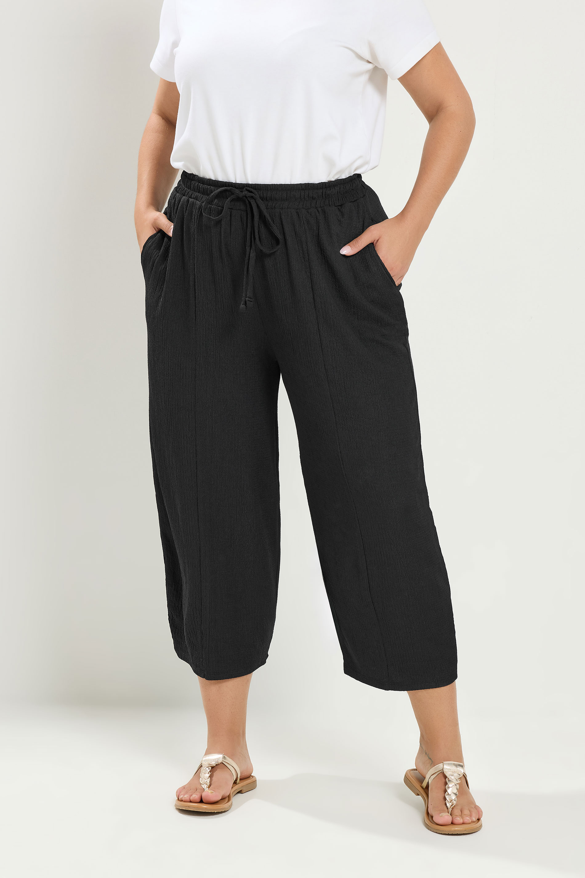 YOURS Plus Size Black Crinkle Barrel Trousers | Yours Clothing 1