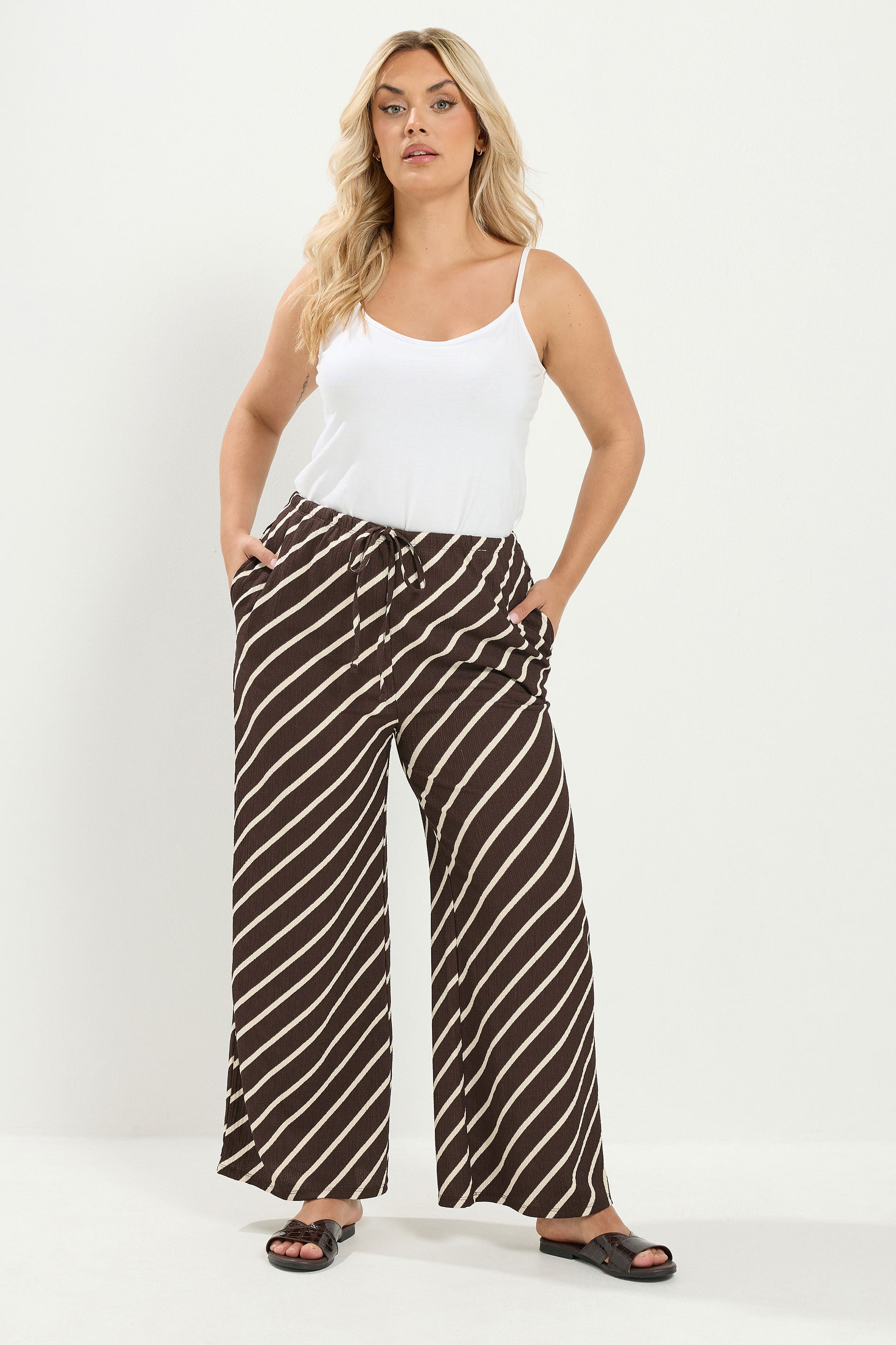 YOURS Plus Size Brown Striped Crinkle Wide Leg Trousers | Yours Clothing 1