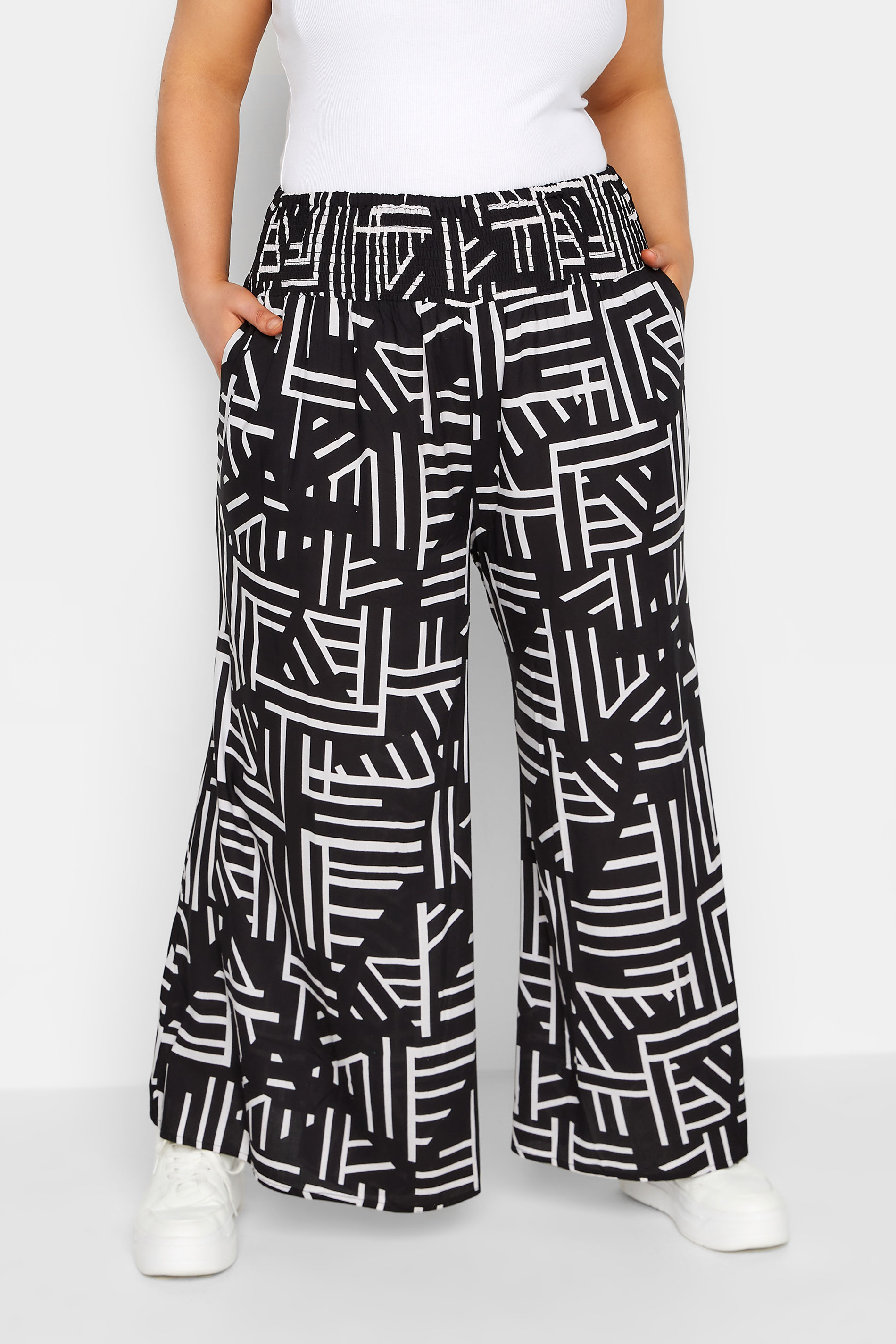 YOURS Plus Size Black Geometric Print Shirred Waist Wide Leg Trousers | Yours Clothing 1