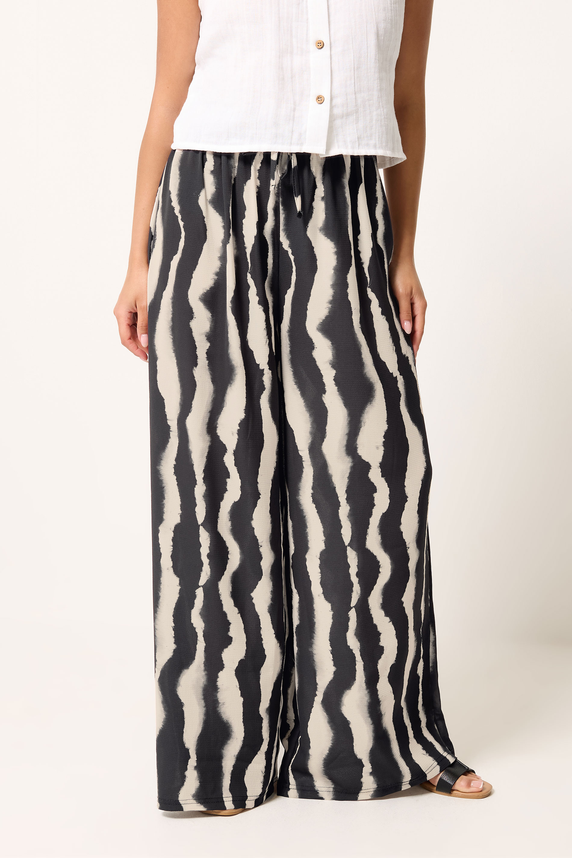 PixieGirl Petite Black Abstract Striped Wide Leg Trousers | PixieGirl 1