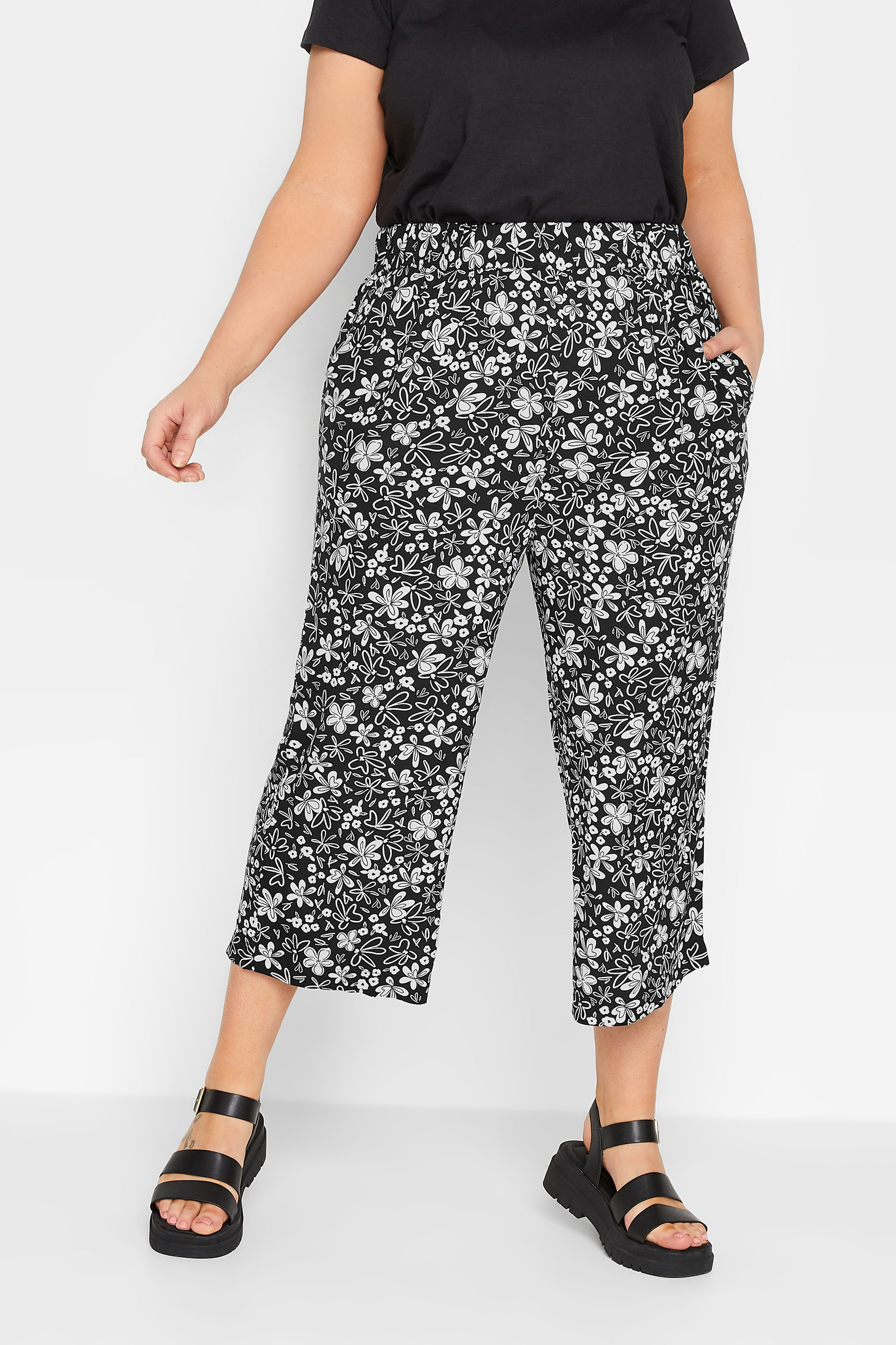 YOURS Plus Size Black Floral Print Cropped Trousers | Yours Clothing 1