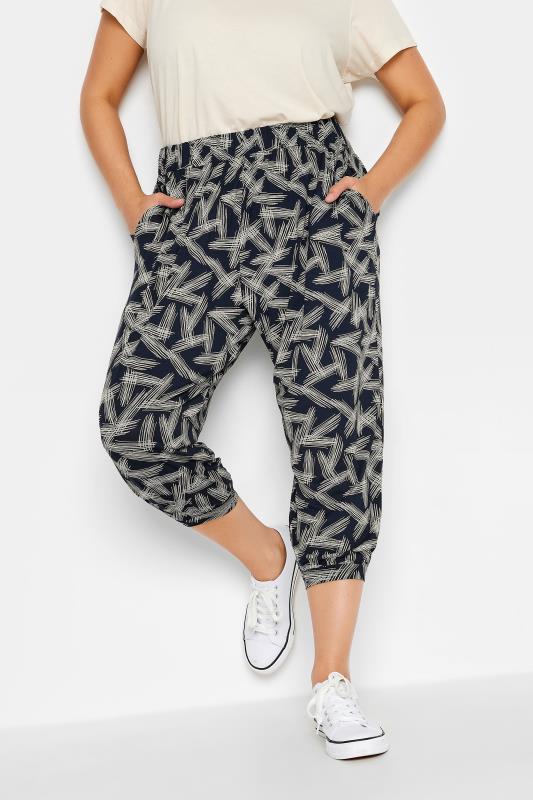YOURS Plus Size Navy Blue Stripe Print Cropped Harem Joggers | Yours Clothing 1