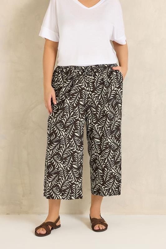 EVANS Plus Size Brown Leaf Print Linen Cropped Trousers | Evans 1