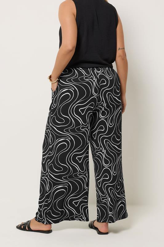 YOURS Plus Size Black Swirl Wide Leg Trousers | Yours Clothing 2