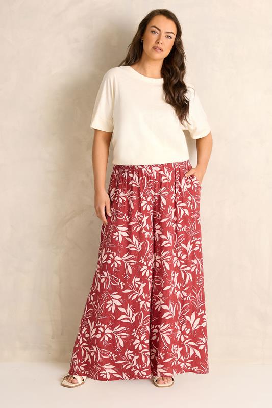 EVANS Plus Size Orange Leaf Print Shirred Waist Trousers | Evans 1