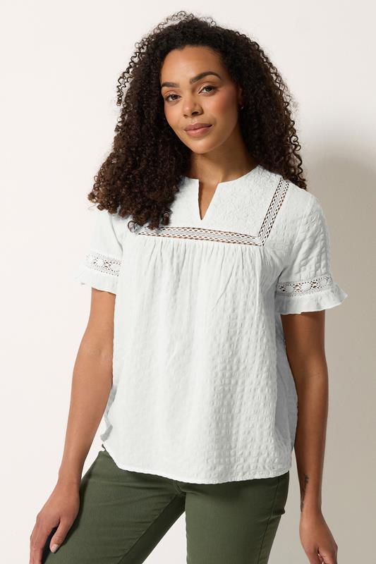  M&Co Haut en coton ivoire brodé à volants