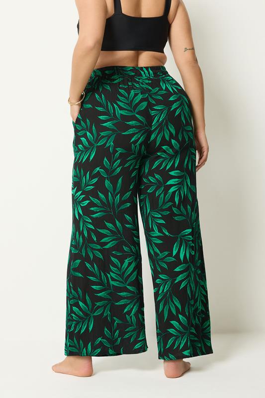 YOURS Plus Size Black & Green Leaf Print Crinkle Beachwear Wide Leg Trousers | Yours Clothing 2
