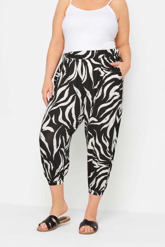 YOURS Plus Size Black Zebra Print Cropped Harem Joggers | Yours Clothing 1