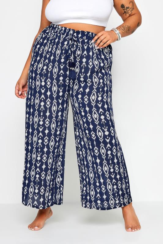 YOURS Plus Size Navy Blue Ikat Print Crinkle Tassel Trousers | Yours Clothing 1