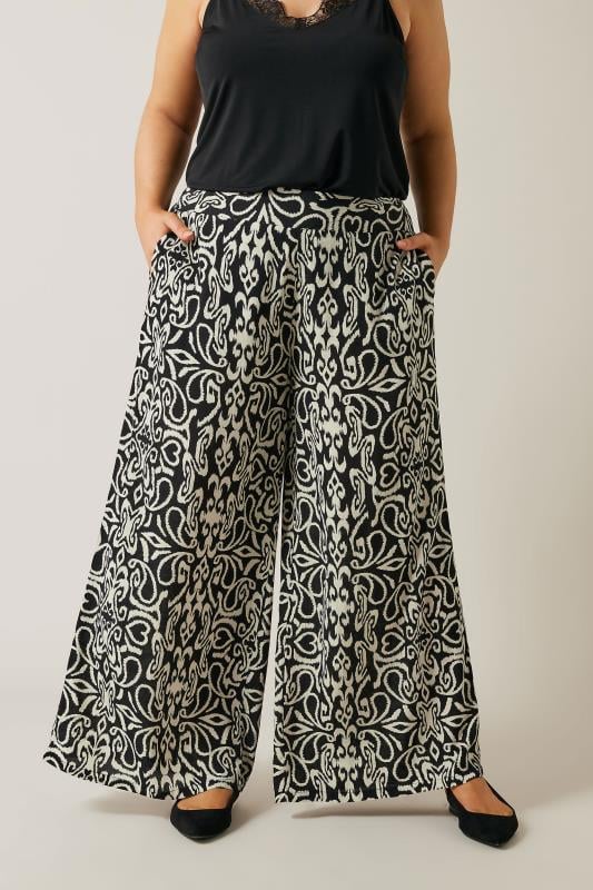 EVANS Plus Size Black & White Abstract Print Wide Leg Trousers | Evans 1