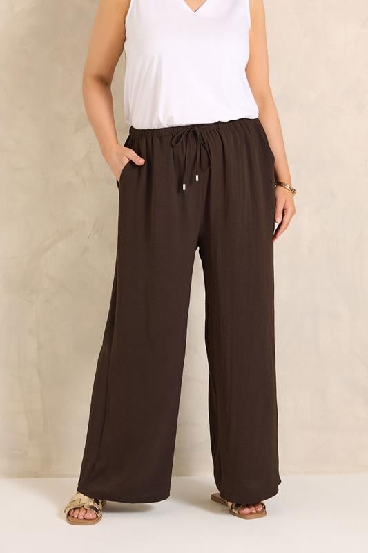 EVANS Plus Size Chocolate Brown Tie Waist Wide Leg Trousers | Evans 1
