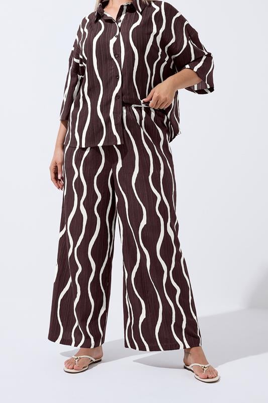 LIMITED COLLECTION Plus Size Brown Wavy Print Wide Leg Trousers | Yours Clothing 1