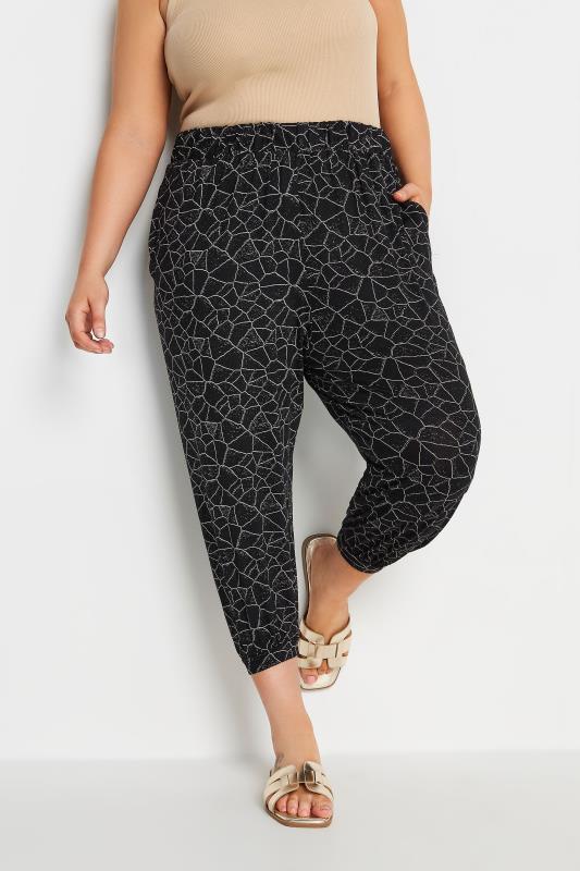 YOURS Plus Size Black Geometric Print Cropped Harem Joggers | Yours Clothing 1