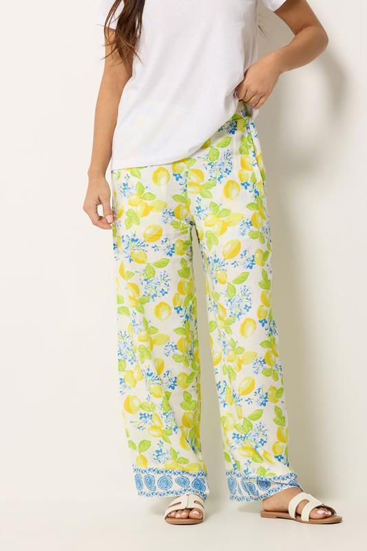 PixieGirl Petite Women's Yellow Lemon Print Wide Leg Trousers | PixieGirl 1