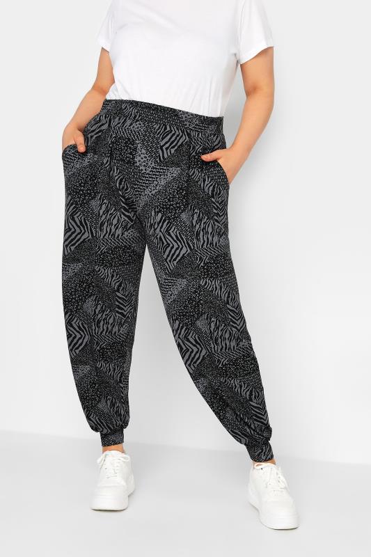 YOURS Curve Plus Size Black Cuffed Animal Print Harem Joggers | Yours Clothing  1