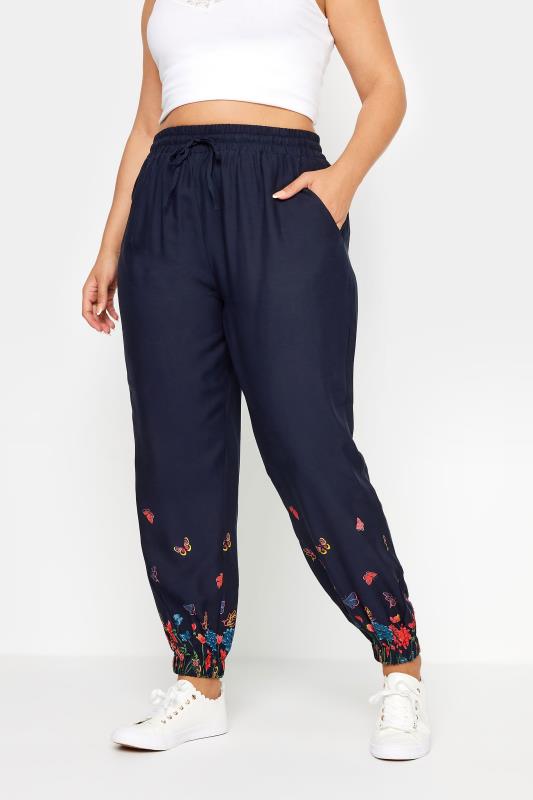 YOURS Plus Size Navy Blue Butterfly Print Border Joggers | Yours Clothing 1
