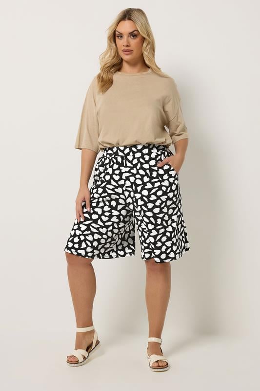 YOURS Plus Size Black Heart Print Shorts | Yours Clothing 1