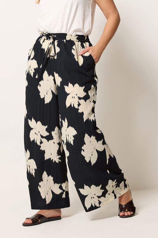 YOURS Plus Size Black Floral Textured Wide Leg Trousers | Yours Clothing 1