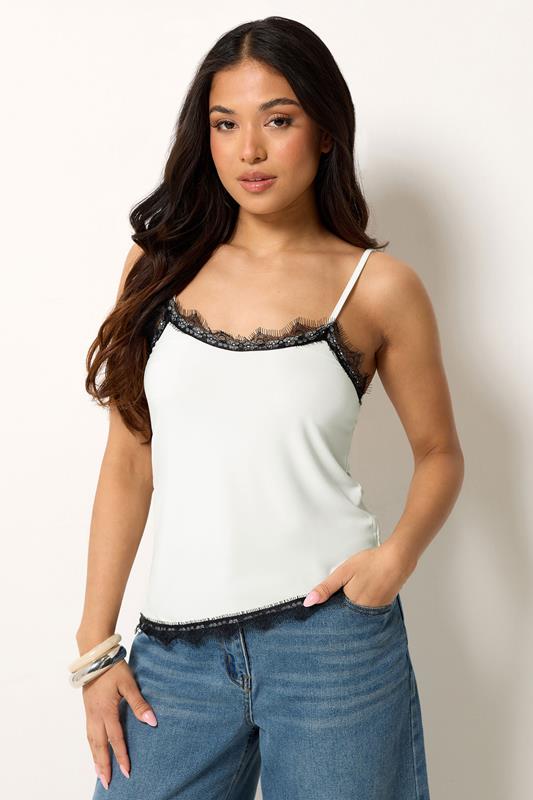  PixieGirl Petite top sin mangas blanco y negro asimétrico con ribetes de encaje