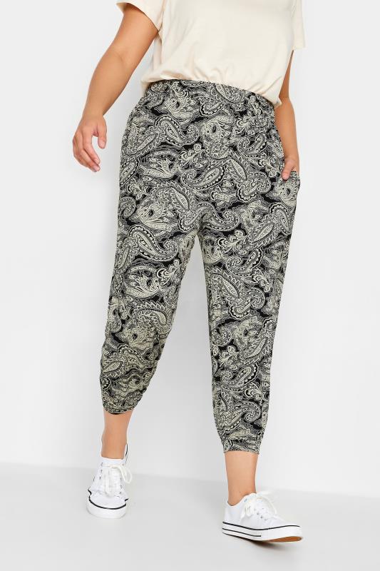 YOURS Plus Size Black Paisley Print Cropped Harem Joggers | Yours Clothing 1