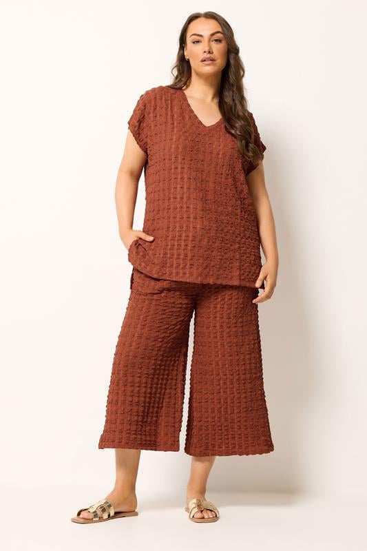 YOURS Plus Size Rust Orange Bubble Textured Cropped Trousers | Yours Clothing 1