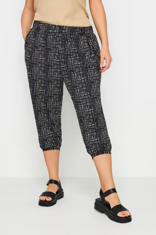 YOURS Plus Size Black Cropped Stripe Print Harem Joggers | Yours Clothing 1