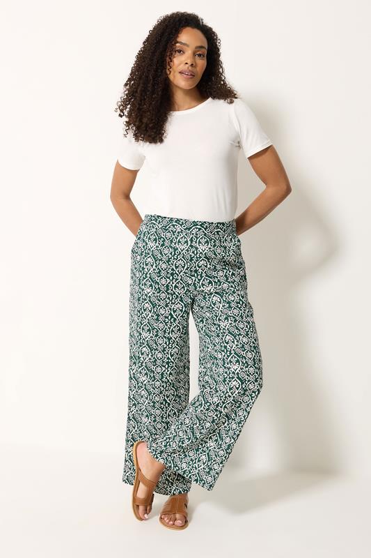 M&Co Green Abstract Print Wide Leg Trousers | M&Co 1
