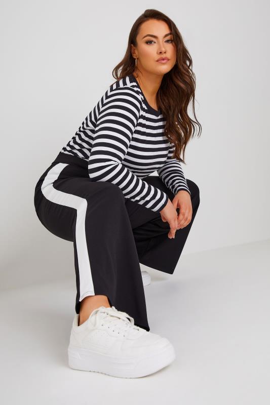 YOURS Plus Size Black & White Contrast Stripe Super Wide Leg Trousers | Yours Clothing 1