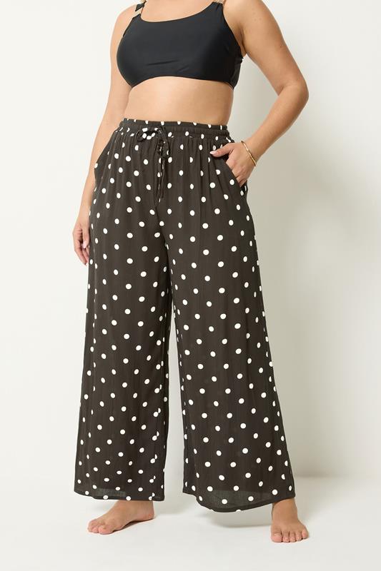YOURS Plus Size Brown Polka Dot Crinkle Beachwear Wide Leg Trousers | Yours Clothing 1