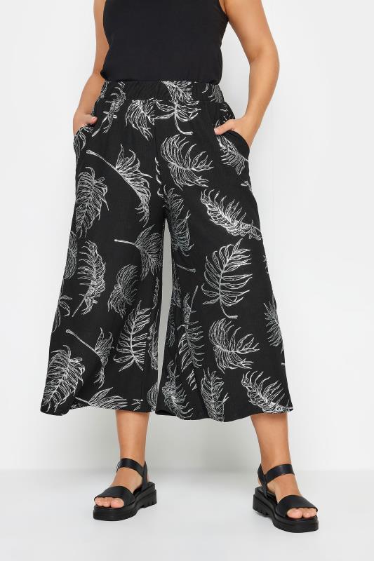 YOURS Plus Size Black Leaf Print Wide Leg Trousers | Yours Clothing 1