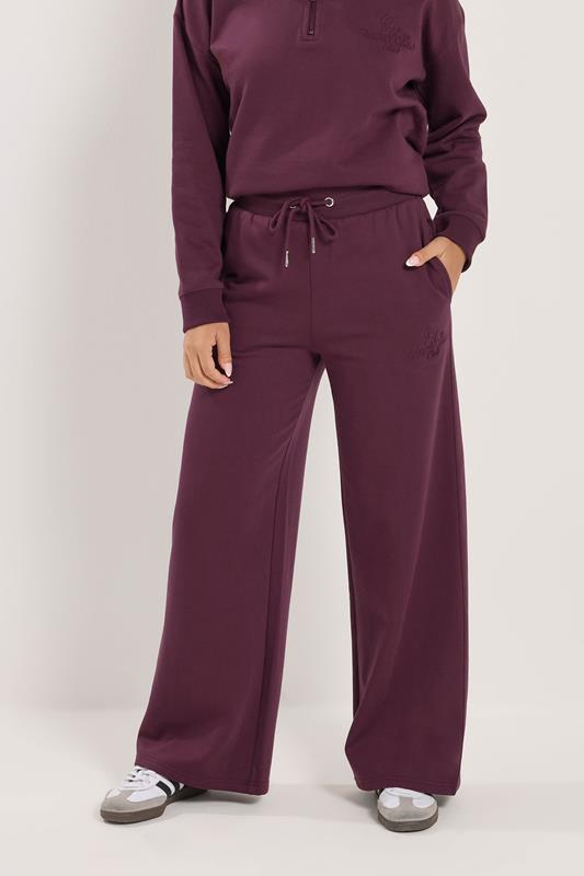 PixieGirl Petite Women's Burgundy Red 'Monte Carlo' Slogan Wide Leg Joggers | PixieGirl 1