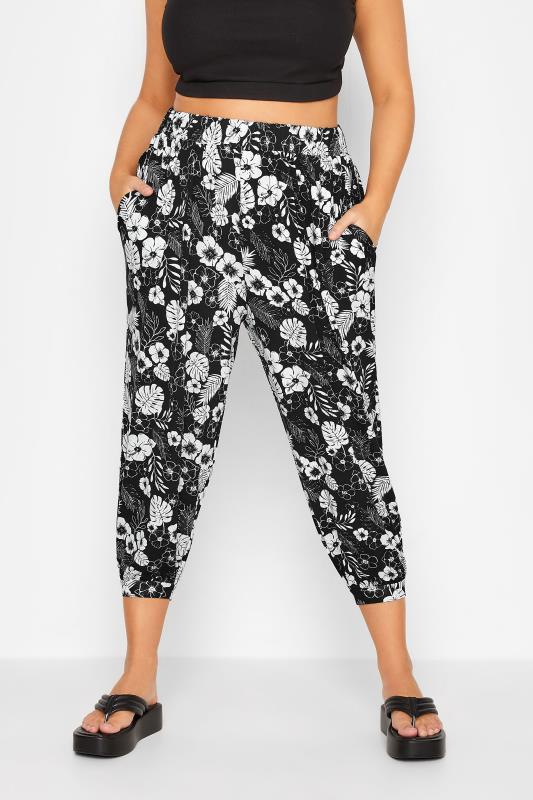 YOURS Plus Size Black Floral Cropped Jersey Harem Joggers | Yours Clothing 1