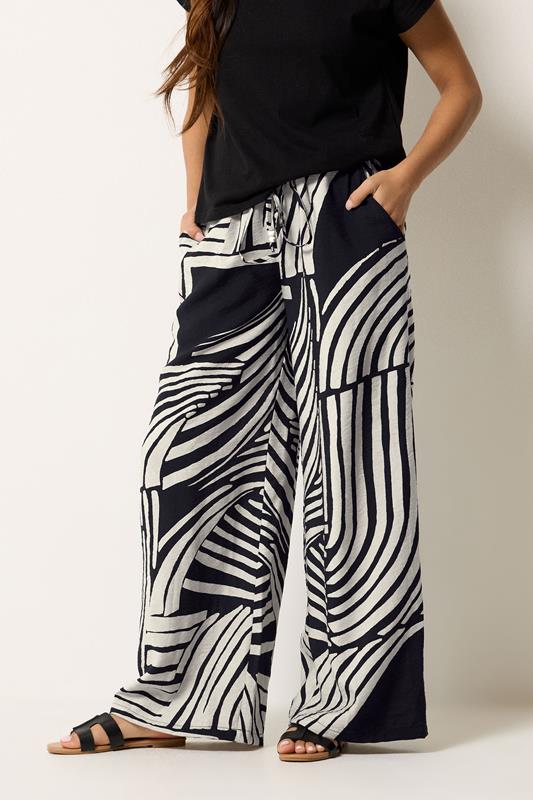 PixieGirl Petite Women's Black Swirl Print Beaded Wide Leg Trousers | PixieGirl 2