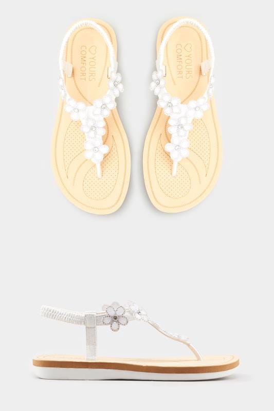 white flip flops with flowers