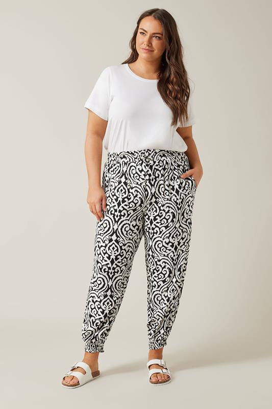 EVANS Plus Size Black Ikat Print Cuffed Harem Trousers | Evans  1