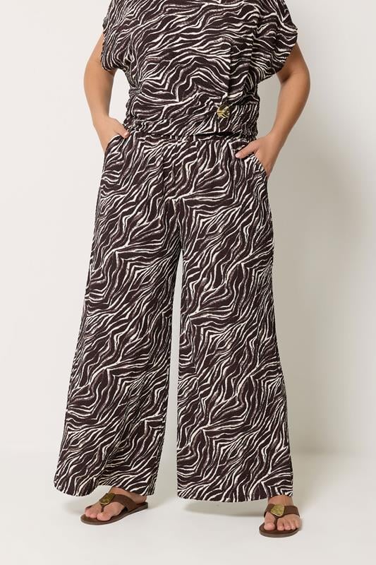 YOURS Plus Size Brown Zebra Crinkle Wide Leg Trousers | Yours Clothing 1