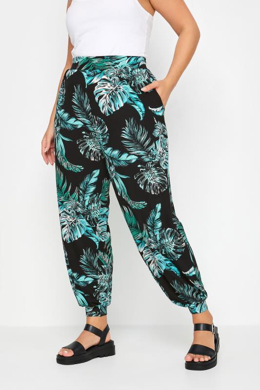 YOURS Plus Size Black Leaf Print Cuffed Harem Trousers | Yours Clothing 1