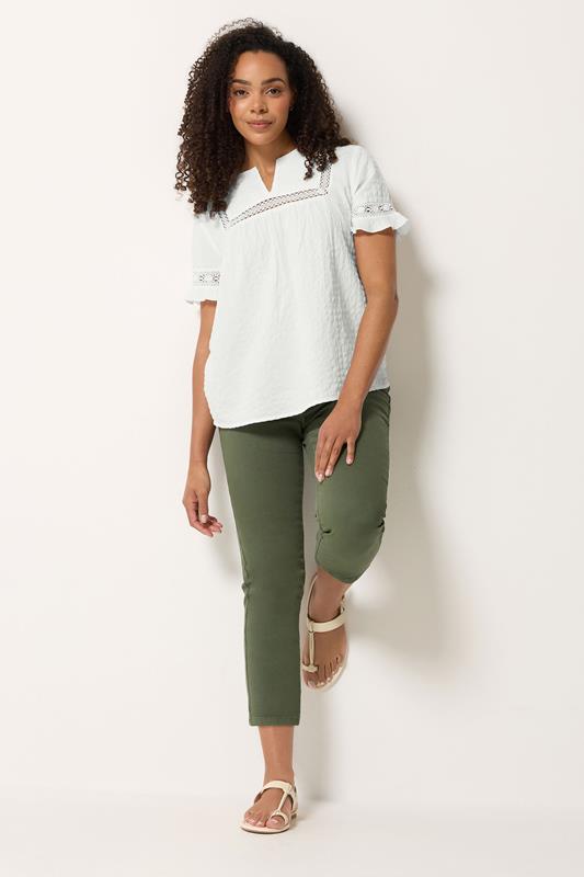 M&Co Ivory White Embroidered Cotton Ruffle Top | M&Co 1