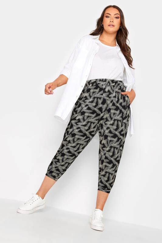 YOURS Plus Size Black Stripe Print Cropped Harem Joggers | Yours Clothing 1