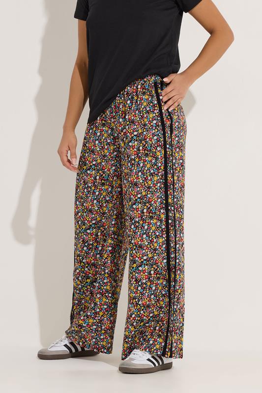 PixieGirl Petite Women's Black Ditsy Floral Side Stripe Wide Leg Trousers | PixieGirl 1
