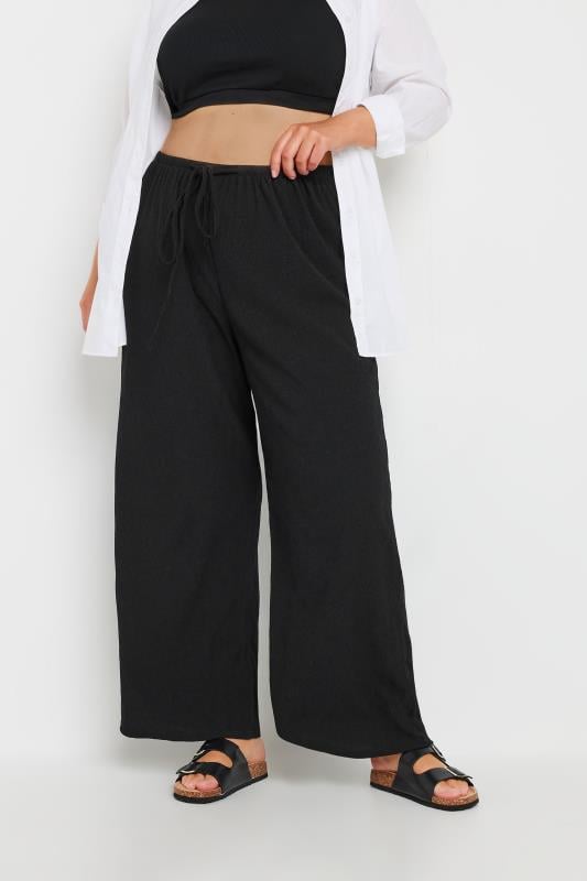 YOURS Plus Size Black Tie Waist Textured Wide Leg Trousers | Yours Clothing 1